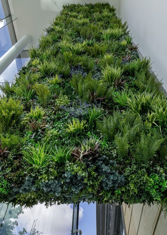 Focal wall design with Vertical Artificial Green Wall at office entrance